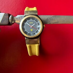 Ferrari Swiss Vintage 1980’s Black and Gold Watch with original Yellow strap.